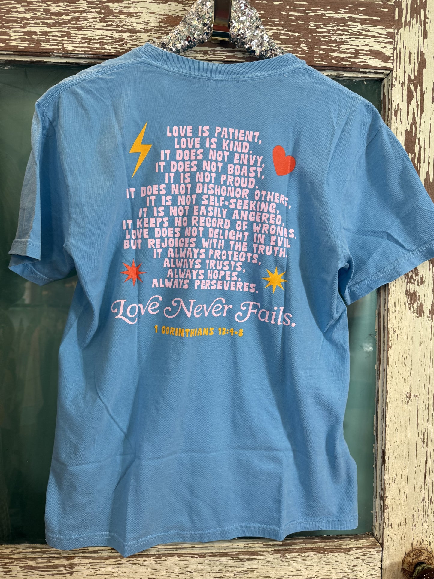 Love Never Fails TEE SHIRT